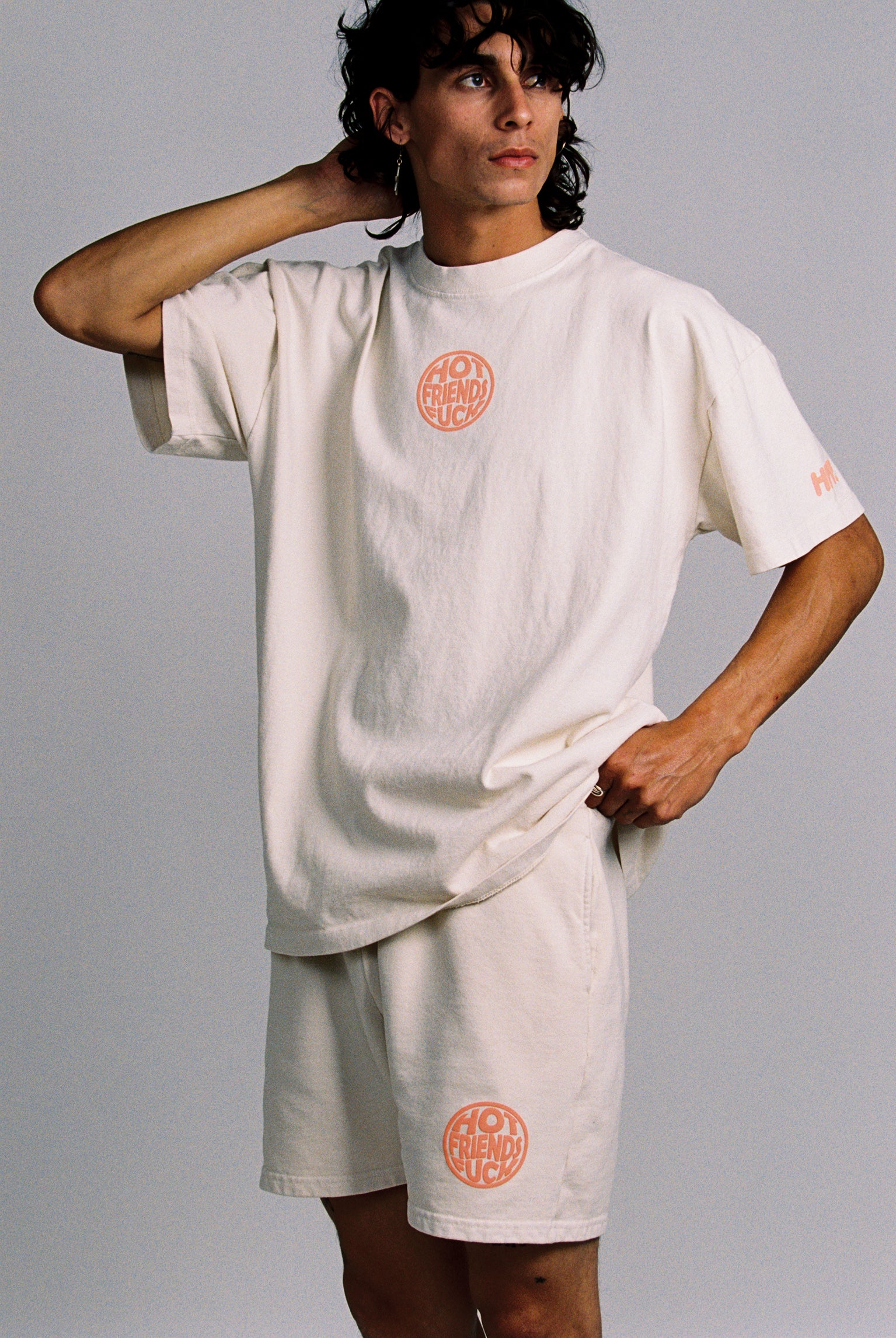 Donovan is wearing the Cream Shorts with Salmon Pink Puff Print