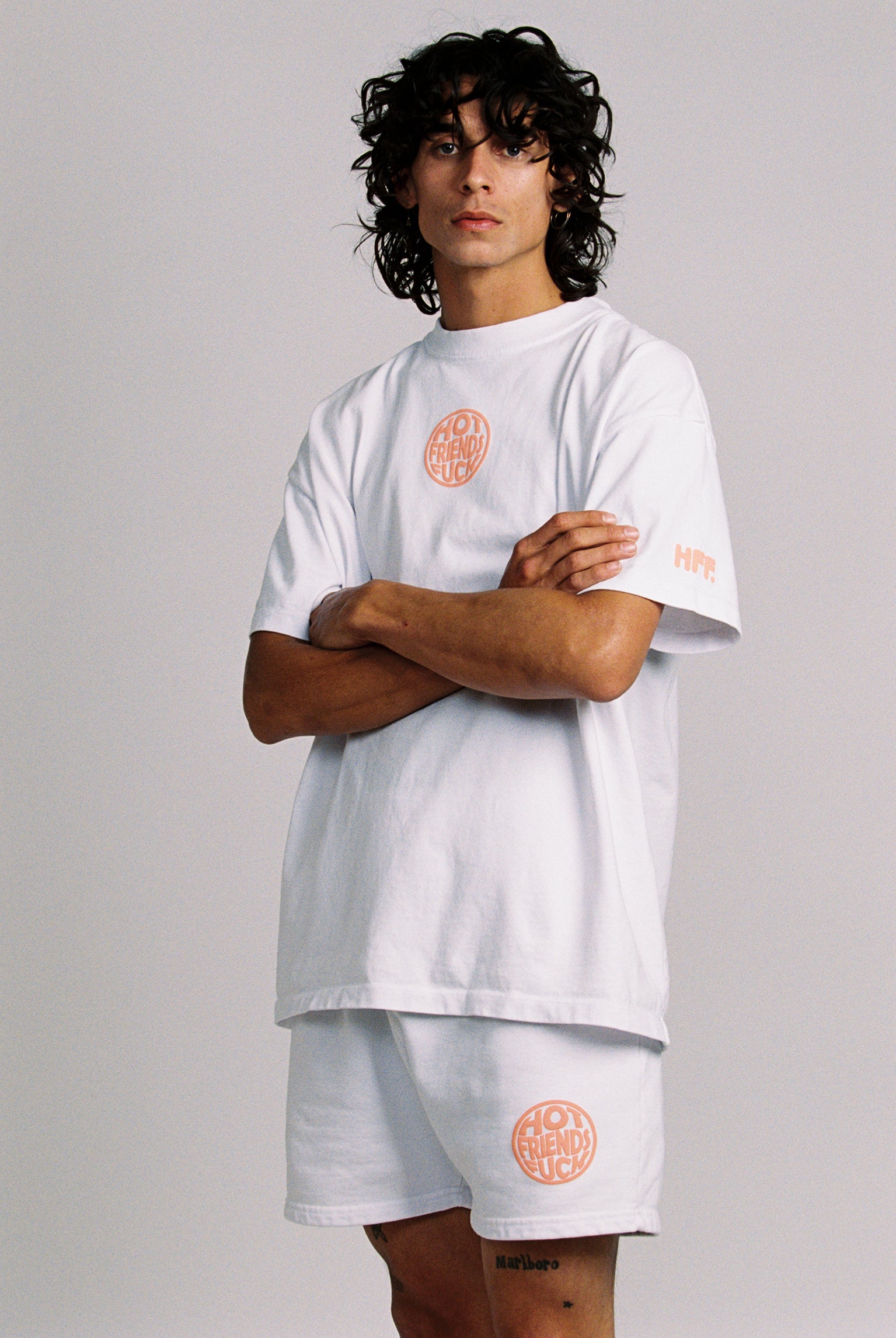 Donovan wearing the White Shirt with Salmon Pink Puff Print