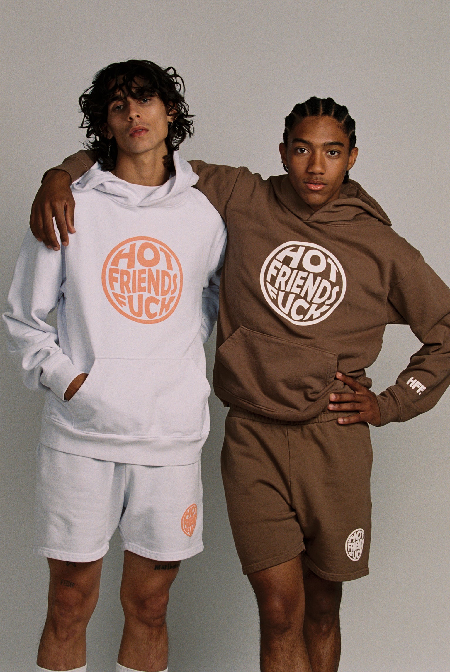 Donovan is wearing the White Hoodie with Salmon Pink Puff Print, and Hechan is wearing the Brown Hoodie with White Puff Print. 20oz French Terry