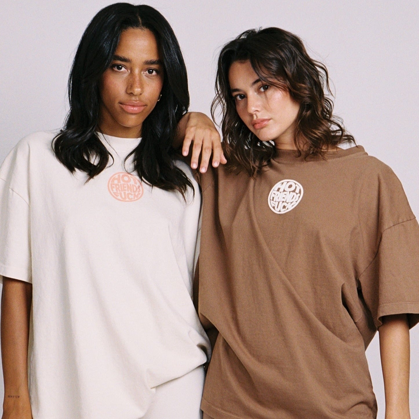 Maddie is wearing the Cream Shirt with Salmon Pink Puff Print, and Sierra is wearing the Brown Shirt with White Puff Print.